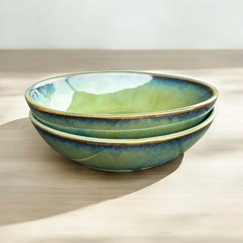 Handmade bowl with flowing green and blue hues