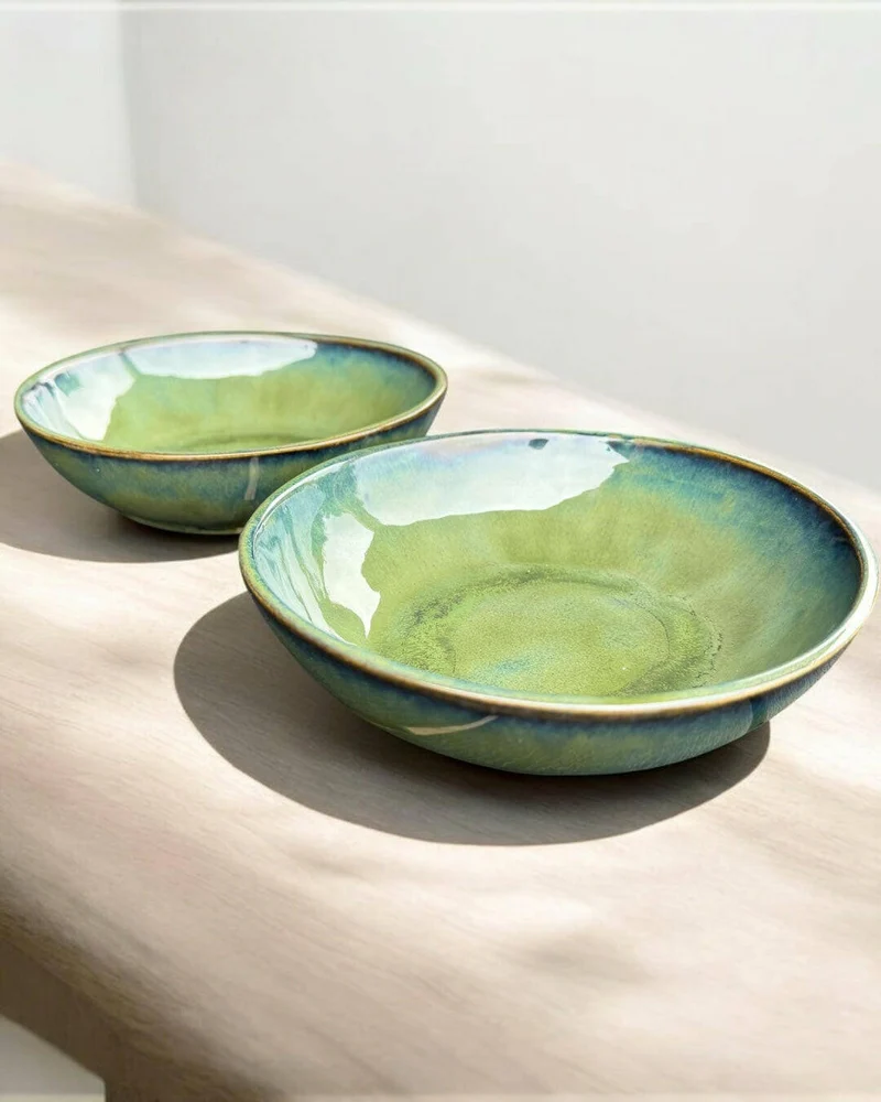 Handmade bowl with flowing green and blue hues