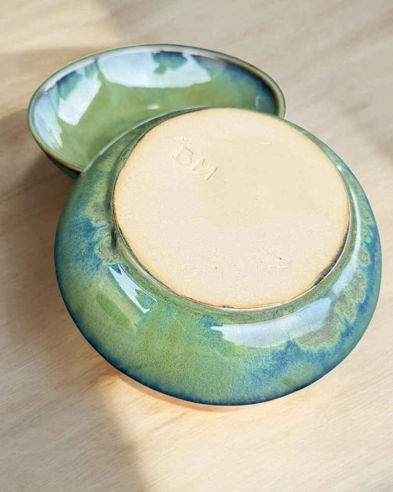Handmade bowl with flowing green and blue hues