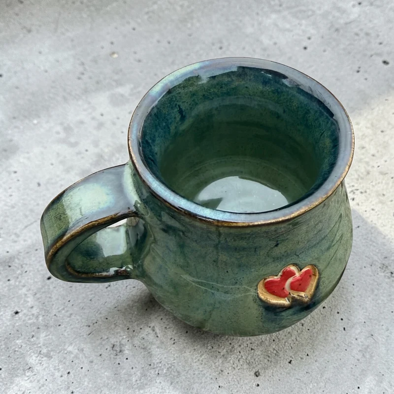 Handmade ceramic mug with hearts