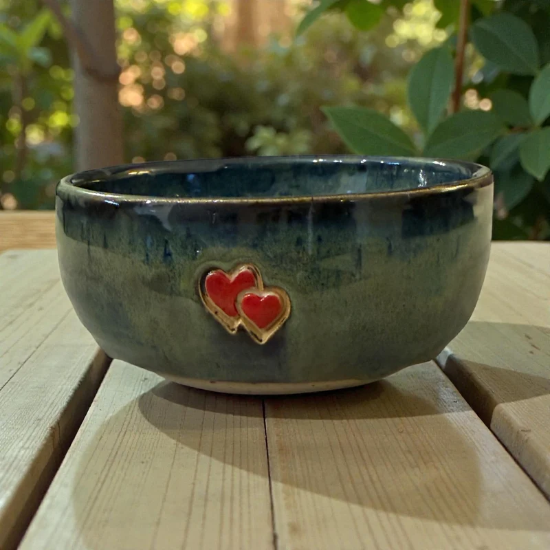 Handmade ceramic bowl with hearts
