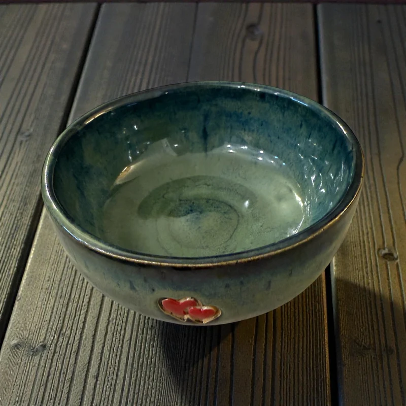 Handmade ceramic bowl with hearts