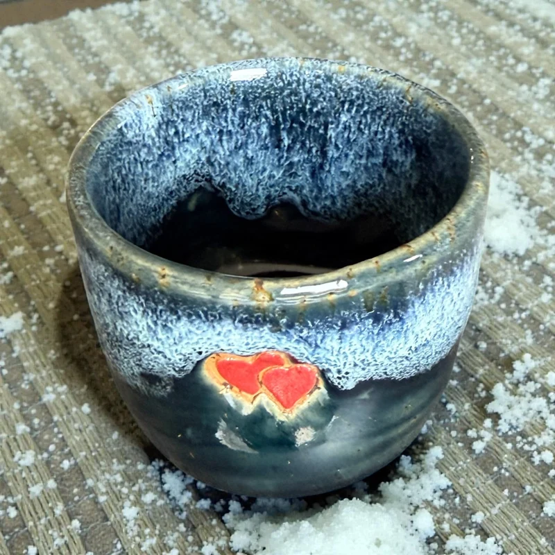 Handmade ceramic cup with hearts